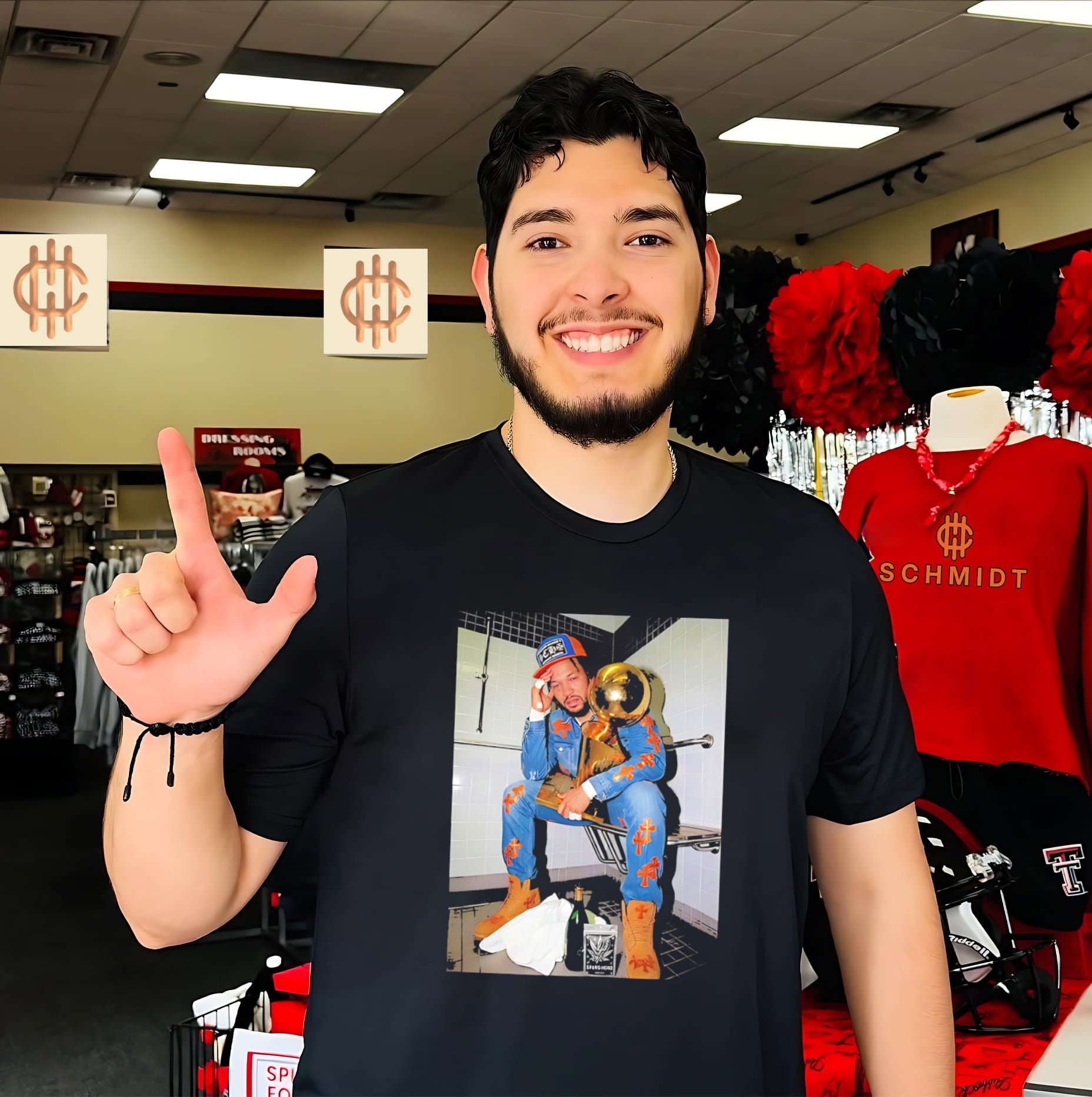 NY Knicks Jalen Brunson holding golden trophy shirt