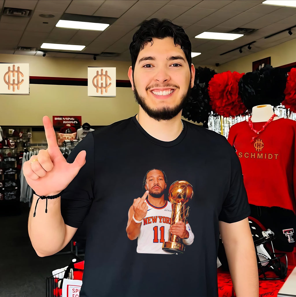 New York Knicks Jalen Brunson holding trophy middle finger shirt