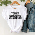 Funny Toilet Clogging Champion T-Shirt – Joke Shirt Humor Meme Gag Gift Tee