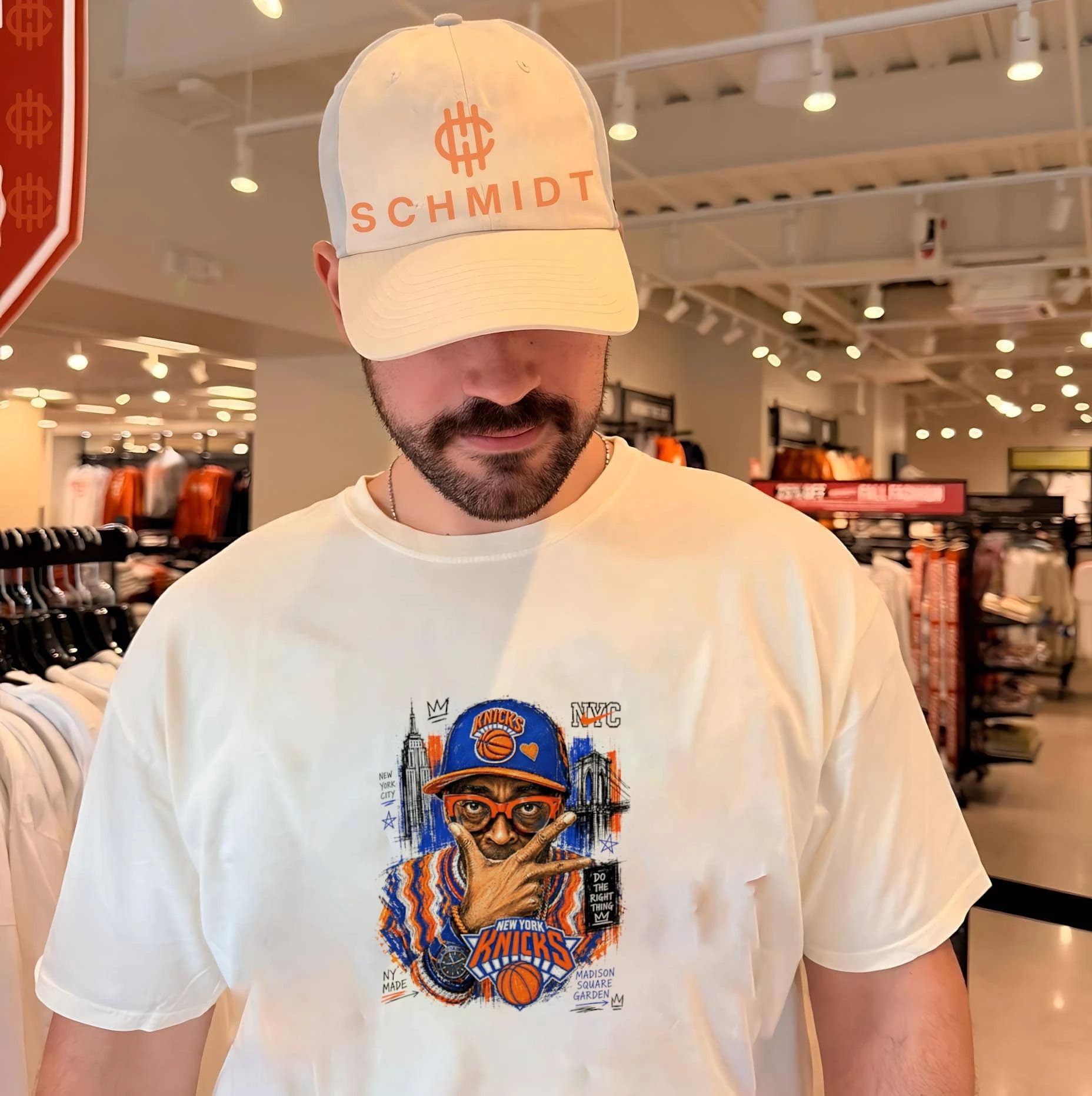 Spike Lee wearing New York Knicks hat illustration shirt